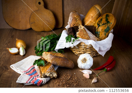 Fresh bread, buckwheat bread, garlic bread, French baguette 112553656