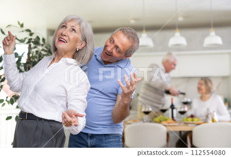 Couple of elderly man and woman dancing in kitchen 112554080