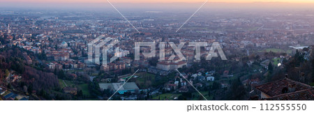 Panoramic view of cityscape Bergamo, aerial view to the city in the mountain valley Panoramic view of cityscape Bergamo, aerial view to the city in the mountain valley 112555550