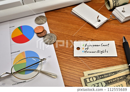 Desk with a card that says European Court of Human Rights 112555689