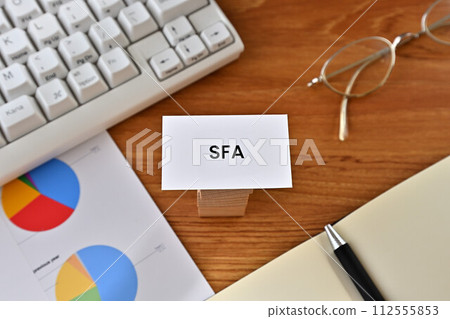 A desk with a card that says SFA A desk with a card that says SFA 112555853