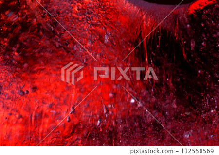 Red under ice macro texture closeup 112558569