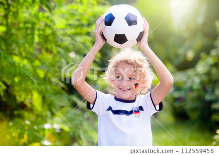 Germany football fan kids. Children play soccer. 112559458