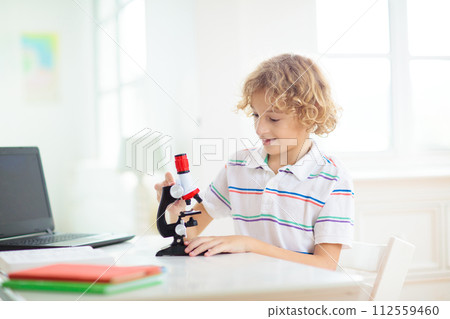 School kids with microscope. Science class. 112559460