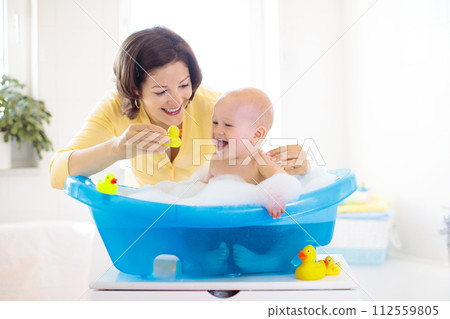 Mother and baby in bath 112559805