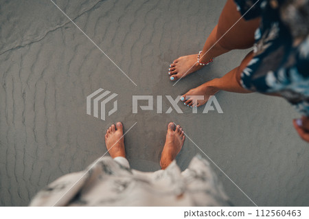 Summer travel concept feet on beach sand Summer travel concept feet on beach sand 112560463