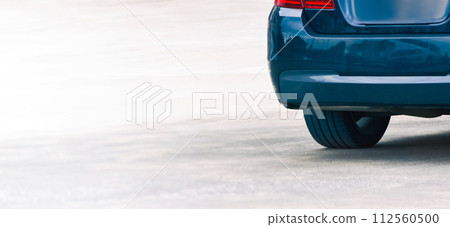 Trunk of blue car parked on a cement road. banner with copy space Trunk of blue car parked on a cement road. banner with copy space 112560500