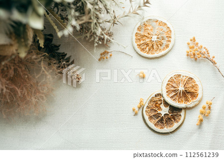 Dried flowers, mimosa and orange peel 112561239