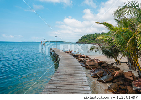 wooden bridge into the sea 112561497