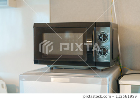 microwave oven in apartment or Home. Kitchenware, dinnerware, lifestyle domestic concept 112561959