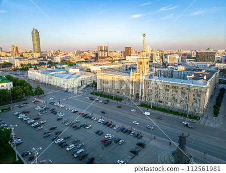 Yekaterinburg City Administration or City Hall and Central square at summer evening. Evening city in the summer sunset, Aerial View. Yekaterinburg City Administration or City Hall and Central square at summer evening. Evening city in the summer sunset, Aerial View. 112561981