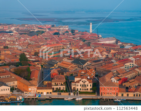 Aerial view of Murano island in Venetian lagoon sea from above, Italy at sunset Aerial view of Murano island in Venetian lagoon sea from above, Italy at sunset 112563448