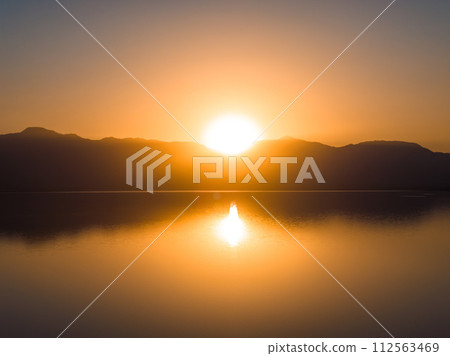 Aerial view over Salton sea in California. Huge lake in the middle of a desert at sunset. 112563469