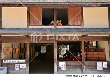 Hina dolls placed in the second floor window facing the street 112566328