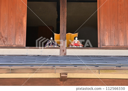 Hina dolls placed in the second floor window facing the street 112566330
