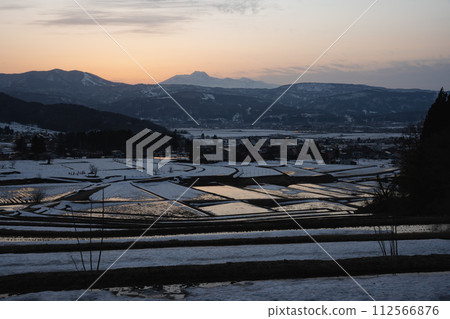 Evening view of rice terraces waiting for the snow to melt 112566876