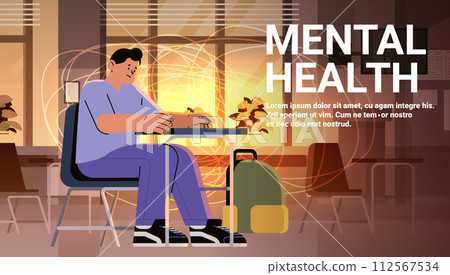 depressed student sitting at workplace sad guy suffering from psychological diseases anxiety mental health awareness month concept depressed student sitting at workplace sad guy suffering from psychological diseases anxiety mental health awareness month concept 112567534