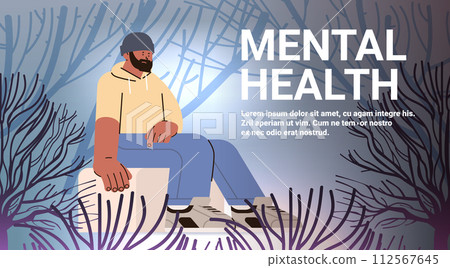 depressed man sitting on stone in forest sad guy suffering from psychological diseases anxiety mental health awareness month concept 112567645