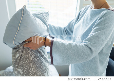 young woman washing bed young woman washing bed 112568687