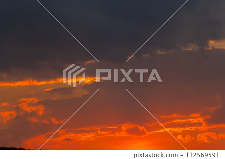 Horizon panorama and dramatic twilight sky and cloud sunset background. Natural sky background texture, beautiful color. Dark clouds, big storm and rain. Weather and nature concept Horizon panorama and dramatic twilight sky and cloud sunset background. Natural sky background texture, beautiful color. Dark clouds, big storm and rain. Weather and nature concept 112569591