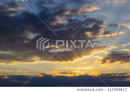 Horizon panorama and dramatic twilight sky and cloud sunset background. Natural sky background texture, beautiful color. Dark clouds, big storm and rain. Weather and nature concept 112569617
