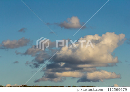 Ornamental clouds. Dramatic sky. Epic storm cloudscape Soft sunlight. Panoramic image texture background graphic resources design Meteorology, heaven hope peace concept Ornamental clouds. Dramatic sky. Epic storm cloudscape Soft sunlight. Panoramic image texture background graphic resources design Meteorology, heaven hope peace concept 112569679