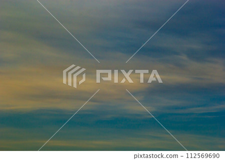 sunset sky with multicolor clouds. Dramatic twilight sky background 112569690