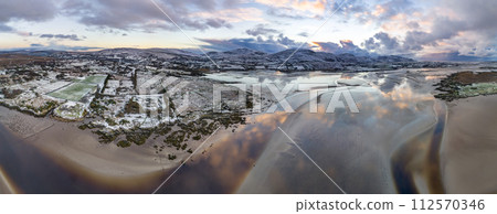 Aerial view of a snow covered Ardara GAA in County Donegal - Ireland 112570346