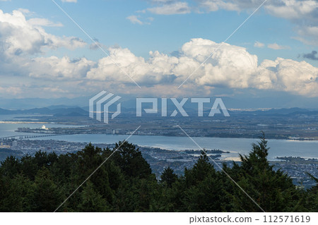 Lake Biwa and the cityscape from the Biwako Observation Deck along the Mt. Hiei Driveway in Otsu City, Shiga Prefecture, Japan 112571619