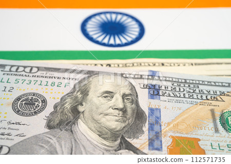 US dollar banknotes on India flag background, Business and finance. US dollar banknotes on India flag background, Business and finance. 112571735
