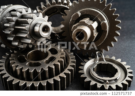 Gear and cogs wheels, clock mechanism, brass metal engine industrial. 112571737