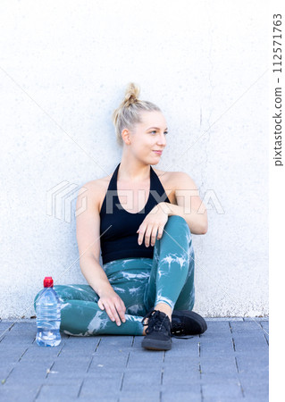 Sporty Millennial Woman Resting After Exercise 112571763