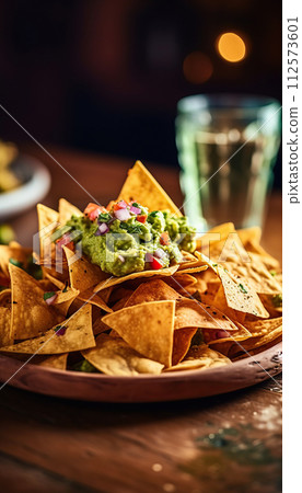Close up view of chicken nacho tortilla with cream sauce. Close up view of chicken nacho tortilla with cream sauce. 112573601