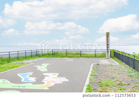 Nemuro City, Hokkaido, the easternmost tip of the mainland, Cape Nosappu in summer, the monument of Cape Nosappu and the surrounding hazy scenery Nemuro City, Hokkaido, the easternmost tip of the mainland, Cape Nosappu in summer, the monument of Cape Nosappu and the surrounding hazy scenery 112573653