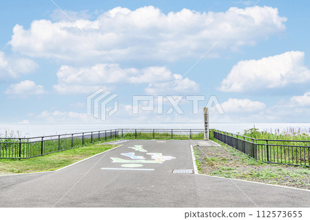 Nemuro City, Hokkaido, the easternmost tip of the mainland, Cape Nosappu in summer, the monument of Cape Nosappu and the surrounding hazy scenery Nemuro City, Hokkaido, the easternmost tip of the mainland, Cape Nosappu in summer, the monument of Cape Nosappu and the surrounding hazy scenery 112573655