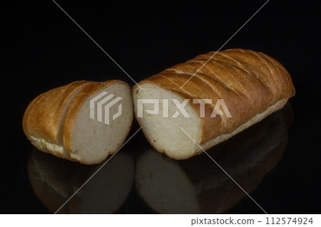 Ordinary white loaf on a black background 112574924