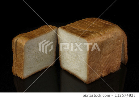 White bread for toast on a black background White bread for toast on a black background 112574925
