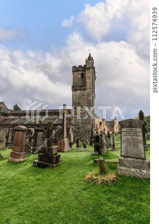 Church of Holy Rude venerable tower vigil over weathered gravestones in historic Stirling cemetery Church of Holy Rude venerable tower vigil over weathered gravestones in historic Stirling cemetery 112574939