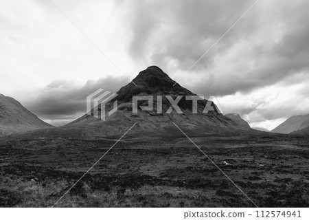 Striking black and white Buachaille Etive Mor, standing majestic in the vast Scottish Highlands 112574941