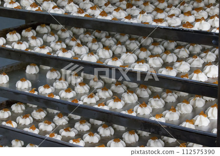 A lot of cookies in the professional kitchen. Culinary products on industrial potholes.Products from sand dough.short pastry cookies 112575390