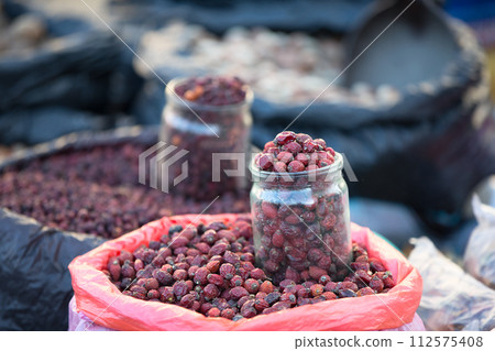 Dry dog rose in a jar Dry dog rose in a jar 112575408