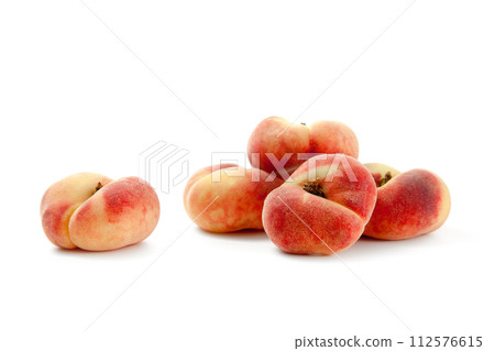 Several saturn peaches or flat peaches isolated on white background with clipping path.. Several saturn peaches or flat peaches isolated on white background with clipping path.. 112576615