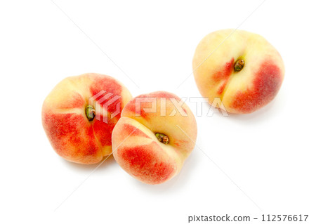 Three saturn peaches or flat peaches isolated on white background with clipping path.. Three saturn peaches or flat peaches isolated on white background with clipping path.. 112576617