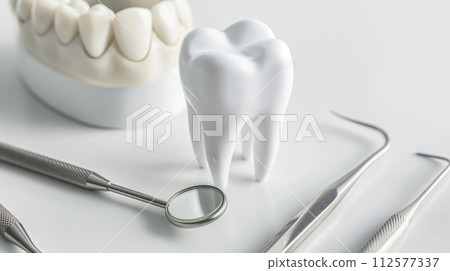 AI-generated content. Dental tools and tooth model on white background. Dental care concept. 112577337