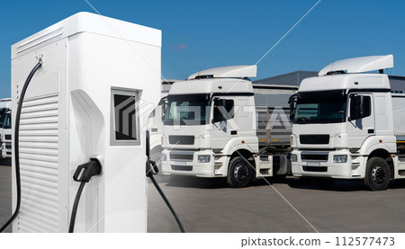 Electric trucks with charging station. Concept Electric trucks with charging station. Concept 112577473
