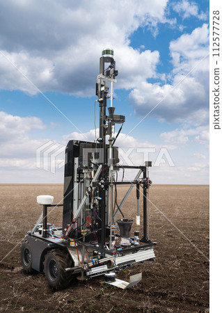Autonomous robot for measuring soil quality in an agricultural field. Smart farming concept 112577728