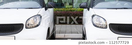 White rental cars in a row. 112577729