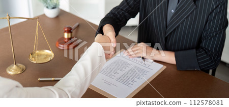 Businesswoman handshake to seal a deal judge female lawyers consultation legal services Consulting in regard to the various contract  112578081