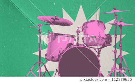 Drums set in pink color over green background. Live performance of expressive music band 112579630