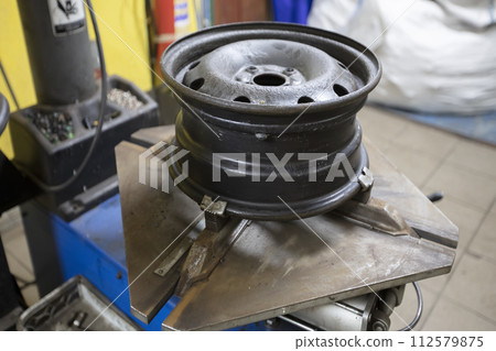 Disassembly of the wheel. Car drive. Tire service. 112579875